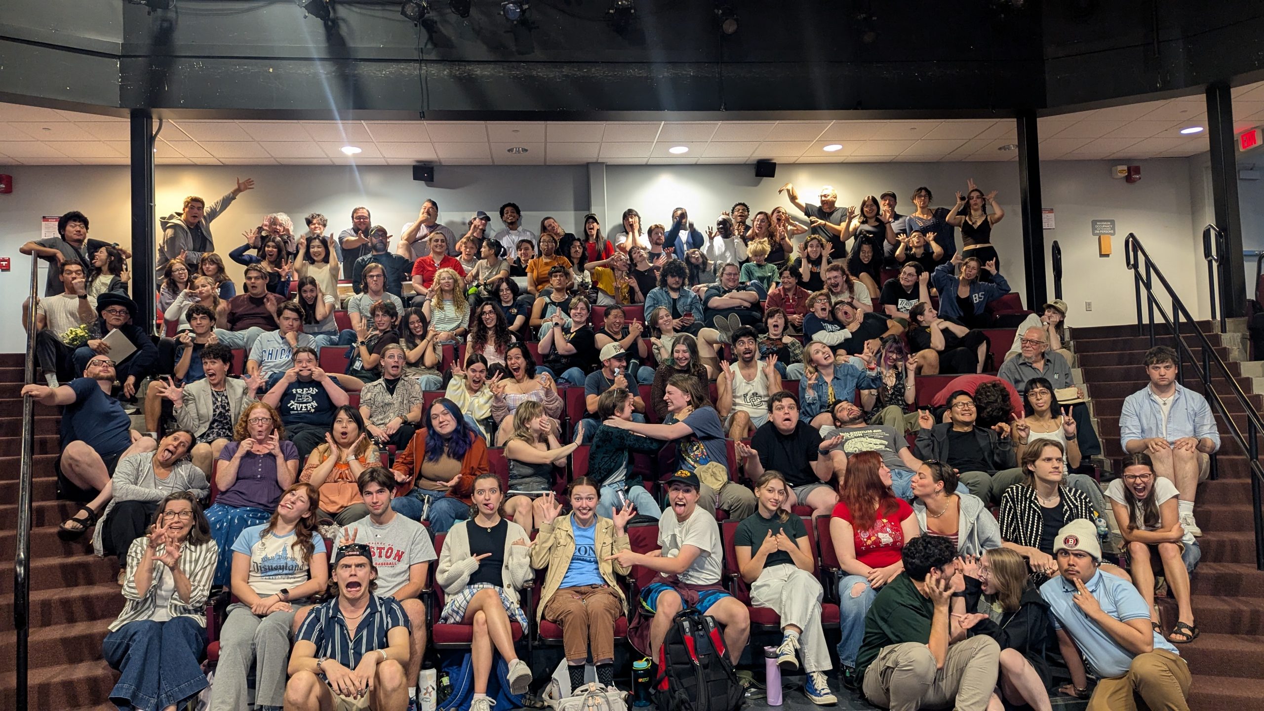 Group of students at UConn Drama convocation, 2026 in the Nafe Katter Theatre.